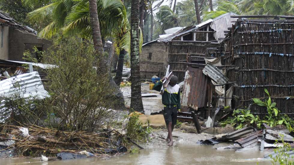 epaselect epa10517496 A man collects some wood on a flooded street near Quelimane, as the storm Freddy hits Mozambique, 12 March 2023. The provincial capital of Quelimane will be the largest urban area closest to the cyclone's point of arrival on the mainland, and its radius (of about 300 kilometres) is expected to extend from Marromeu to Pebane, then moving inland towards Cherimane and southern Malawi. This is one of the longest lasting storms ever, after it formed at the beginning of February in the Asian seas, crossing the entire Indian Ocean to the east African coast.  EPA/ANDRE CATUEIRA