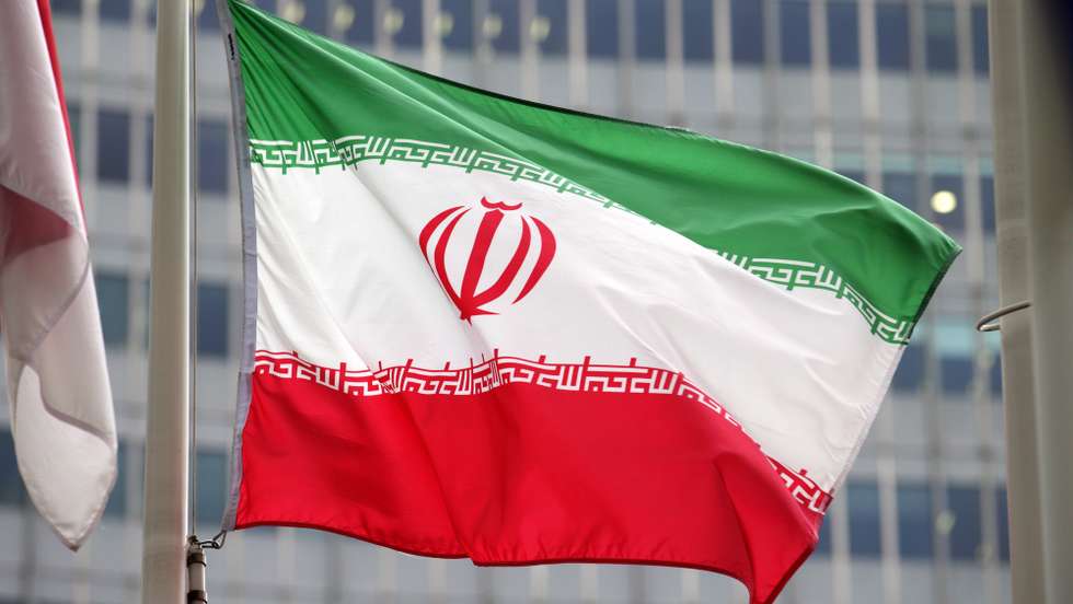 epa11730691 Iran's flag flies outside the International Atomic Energy Agency (IAEA) headquarters during the opening session of an IAEA Board of Governors meeting in Vienna, Austria, 20 November 2024.  EPA/HEINZ-PETER BADER