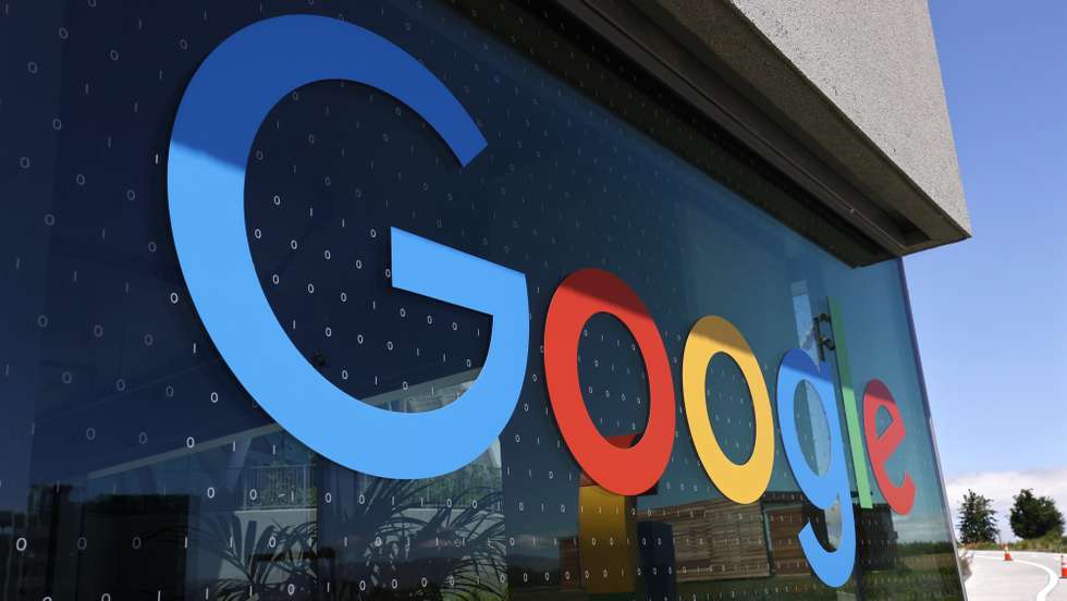 epa09952080 Google logo and binary code on the window of Google's new Bay View campus building, BV100  and during a media tour in Mountain View, California, USA, 16 May 2022. Google announced on 16 May the opening of its new Bay View campus in Silicon Valley, representing the company's first time developing its own major campus and the largest to pursue multiple green building certifications. The Bay View campus was designed by architects Bjarke Ingels Group (BIG) and Heatherwick Studio, as well as Google's design and engineering teams and spans 42 acres adjacent to the open space, two office buildings, and 1,00-person event center, and 240 short-term employee accommodations units. The campus incorporates biophilic design principles, including greenery, natural daylight and views outside from every desk to improve the health and wellbeing of those inside the building. The new building is to operate every hour of every day on carbon-free energy by 2030, the first-of-its-kind dragonscale solar skin, as well as nerby wind farms, will power Bay View on carbon-free energy 90 percent of the time. Bay View is 100 percent electric where even the kitchens are electric to decrease carbon emissions. To help deliver on its commitment to replenish 120 percent of the water it comsumes by 2023, the site is net water-positive with all non-potable water demands being met using the recycled water it generates on site. A series of above-ground ponds gather rainwater, combine with building wastewater treatment systems, together serve as a water source for cooling towers, flushing toilets, and landscape irrigation.  EPA/JOHN G. MABANGLO