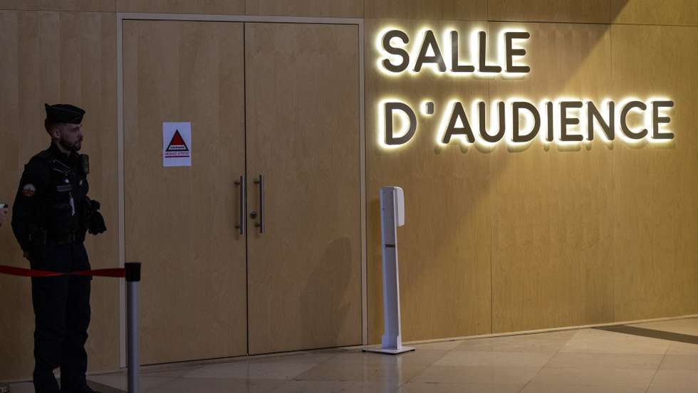 epa11607582 A police officer stands outside a courtroom ahead of the start of Peter Cherif's trial in Paris, France, 16 September 2024. Peter Cherif is a jihadist allegedly linked to the January 2015 gun attack on the Paris offices of Charlie Hebdo magazine. His trial started on September 16 at the specially composed Paris Assize Court.  EPA/ANDRE PAIN