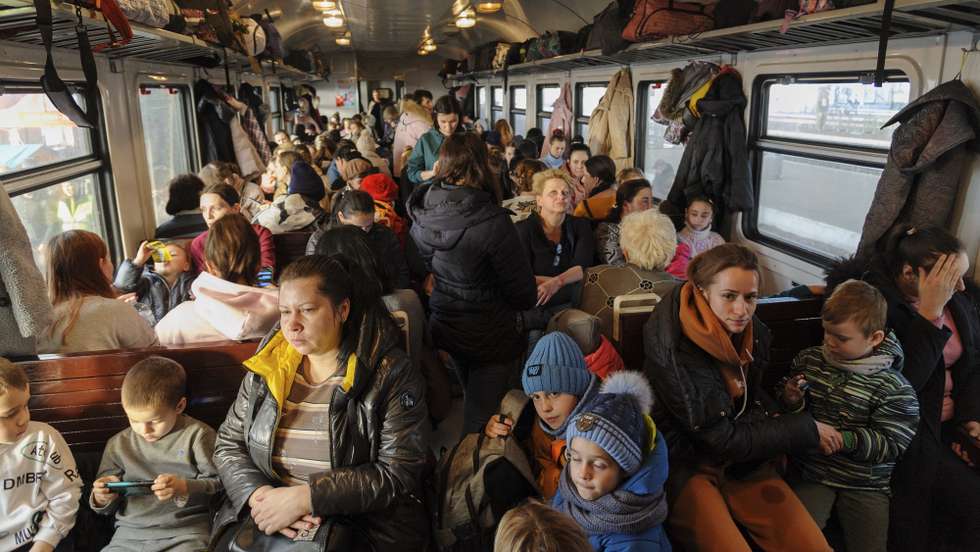 epa09840188 (FILE) - Ukrainian refugees depart to Poland at the railway station in Lviv, western Ukraine, 15 March 2022 (issued 21 March 2022). Since Russia invaded Ukraine one month ago on 24 February 2022, more than three million Ukrainians became refugees, around 700 civilians were killed and over 1.000 more injured, the United Nations said.  EPA/MYKOLA TYS  ATTENTION: This Image is part of a PHOTO SET