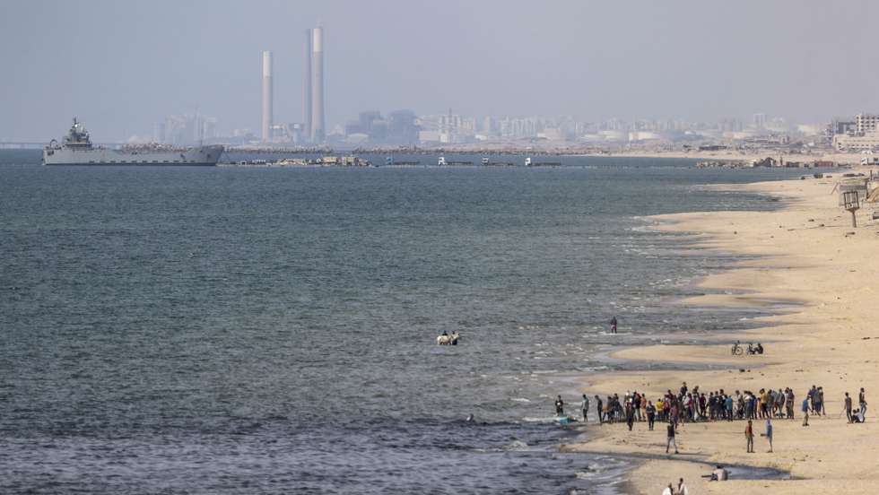 epa11353661 A ship is seen from southern Gaza, moored near a temporary floating pier anchored by the United States to boost aid deliveries, Gaza, 19 May 2024. Since 07 October 2023, up to 1.7 million people, or more than 75 percent of the population, have been displaced throughout the Gaza Strip, some more than once, in search of safety, according to the United Nations Relief and Works Agency for Palestine Refugees in the Near East (UNRWA), which added that the Palestinian enclave is 'on the brink of famine', with 1.1 million people (half of its population) 'experiencing catastrophic food insecurity' due to the conflict and restrictions on humanitarian access.  EPA/MOHAMMED SABER