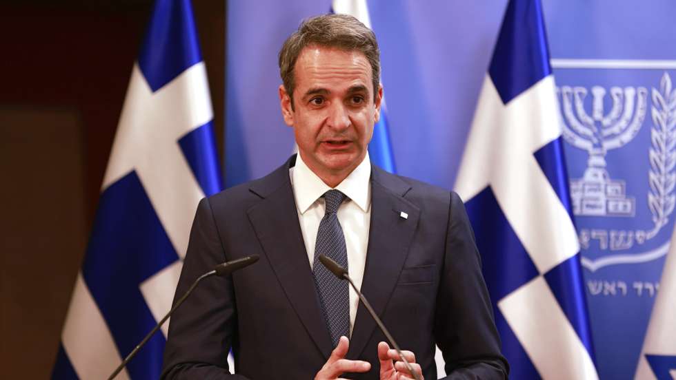 epa08996957 Greek Prime Minister Kyriakos Mitsotakis delivers a statement next to the Israeli Prime Minister Benjamin Netanyahu (unseen) after their meeting in the Prime Minister's office in Jerusalem, 08 February 2021.  EPA/MENAHEM KAHANA / POOL