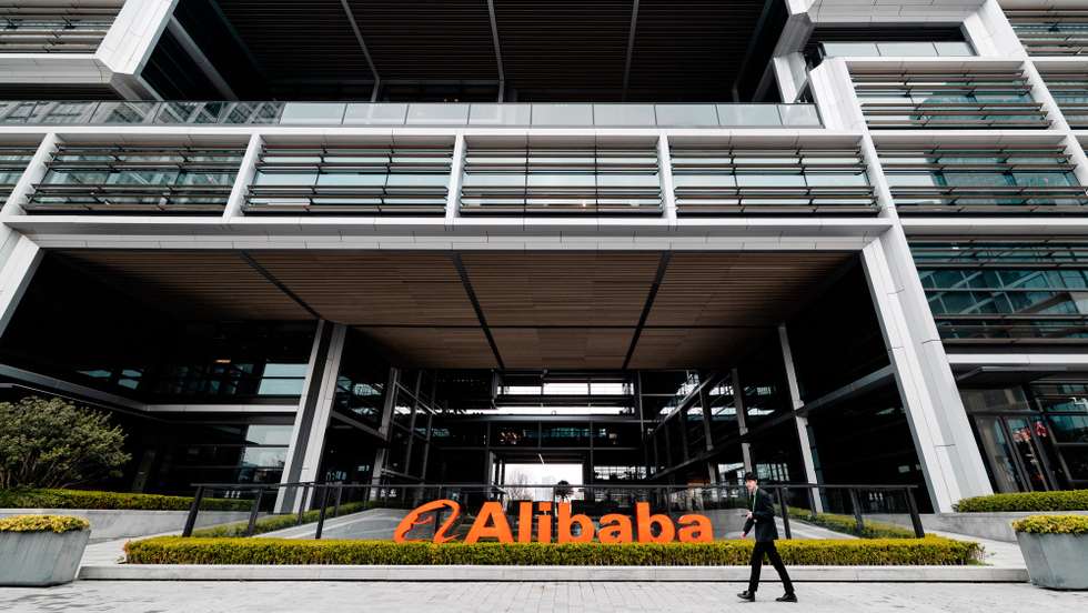 epa12832571 A man walks past Alibaba logo on their building in Xuhuibinjiiang Park, also known as 'AI Park,' home to many Chinese companies involved in AI (artificial intelligence) research, in Shanghai, China, 19 March 2026.  EPA/ALEX PLAVEVSKI