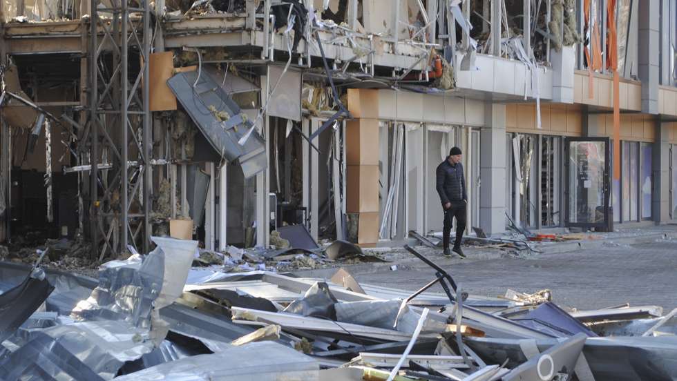 epa11978021 Local people inspect the site of a drone strike in Odesa, southwestern Ukraine, 21 March 2025, amid the Russian invasion. As a result of overnight Russian drone strikes on the Odessa region, at least three people were injured and fires broke out in a shopping center and shops, and a high-rise building was damaged, according to the State Emergency Service of Ukraine (SESU).  EPA/IGOR TKACHENKO