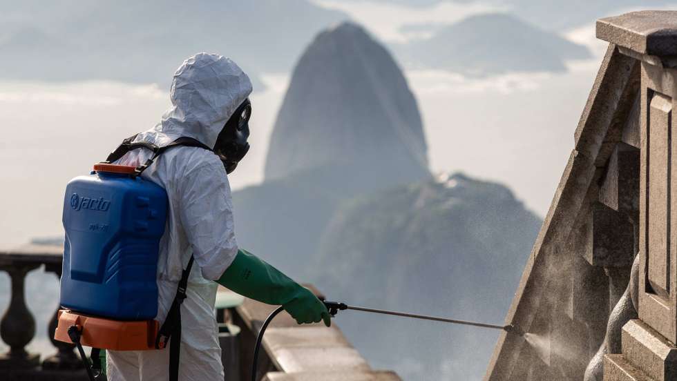 epa08601114 Soldiers of the Brazilian army disinfect the Cristo Redentor monument to reopen the tourist spot, in Rio de Janeiro, Brazil, 13 August 2020. The Christ of Corcovado, the most iconic image of Brazil in the world, will reopen its doors to the public on 15 August, as well as the PÃ£o de AÃ§Ãºcar hill, the aquarium and the giant wheel, other of the main tourist attractions of Rio de Janeiro, after five months of inactivity due to COVID-19.  EPA/FERNANDO MAIA