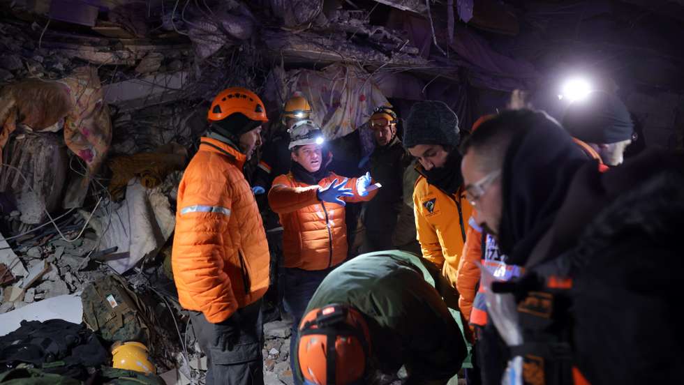 epa10455226 Israeli army and United Hatzalah rescue teams search the rubble of a collapsed building in the city of Kahramanmaras, southeastern Turkey, 08 February 2023. More than 11,000 people have died and thousands more are injured after two major earthquakes struck southern Turkey and northern Syria on 06 February. Authorities fear the death toll will keep climbing as rescuers look for survivors across the region.  EPA/ABIR SULTAN