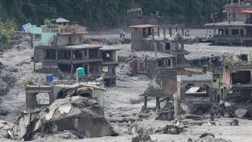 epa13198291 Houses are seen in ruins in Bidur, Nepal, 29 August 2026, following flash floods earlier this week. More than 600 people were killed, and hundreds remain missing across northern Nepal after a glacial collapse and avalanche triggered flash floods and mudslides along the Bhotekoshi and Trishuli river valleys near the Nepal-Tibet border, causing widespread destruction to settlements and infrastructure, according to the National Disaster Risk Reduction and Management Authority (NDRRMA).  EPA/YONHAP SOUTH KOREA OUT