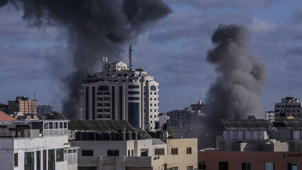 epa09207489 Smoke rise after an israeli air strike in Gaza City, 17 May 2021. In response to days of violent confrontations between Israeli security forces and Palestinians in Jerusalem, various Palestinian militants factions in Gaza launched rocket attacks since 10 May that killed at least six Israelis to date. Gaza Strip's health ministry said that at least 65 Palestinians, including 13 children, were killed in the recent retaliatory Israeli airstrikes. Hamas confirmed the death of Bassem Issa, its Gaza City commander, during an airstrike.  EPA/HAITHAM IMAD