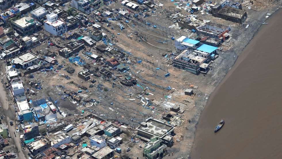 epa09211967 A handout photo made available by the Gujarat information department shows an aerial view of the damage caused by the Cyclone Tauktae, in Gujarat, India, 19 May 2021. A powerful cyclone that hit the western coast of India has killed at least 17 people, officials said on 18 May. The intensity of the cyclone Tauktae weakened hours after it made landfall, bringing heavy rains and gusty winds in the western state of Gujarat and its adjoining regions.  EPA/GUJARAT INFORMATION DEPARTMENT HANDOUT  HANDOUT EDITORIAL USE ONLY/NO SALES