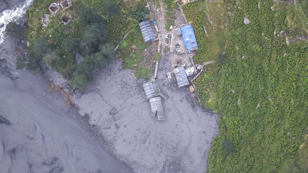 epa13295844 A handout photo made available by the National Trust for Nature Conservation-Manaslu Conservation Area Project (NTNC-MCAP) shows an aerial view of the Budhi Gandaki River swollen by flash floods in Gorkha district, Nepal, 11 October 2026. A debris-laden flash flood has swept away more than a dozen houses and bridges, according to the National Disaster Risk Reduction and Management Authority (NDRRMA).  EPA/NTNC-MCAP/HANDOUT  HANDOUT EDITORIAL USE ONLY/NO SALES