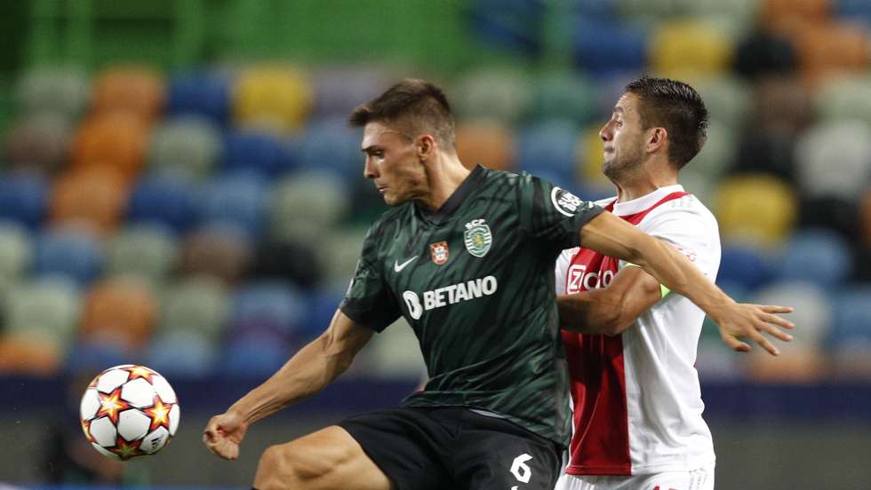 Sporting player Joao Palhinha (L) in action against Ajax player Dusan Tadic (R) during their UEFA Champions League Group C soccer match at Jose Alvalade Stadium in Lisbon, Portugal, 15 September 2021. ANTONIO COTRIM/LUSA