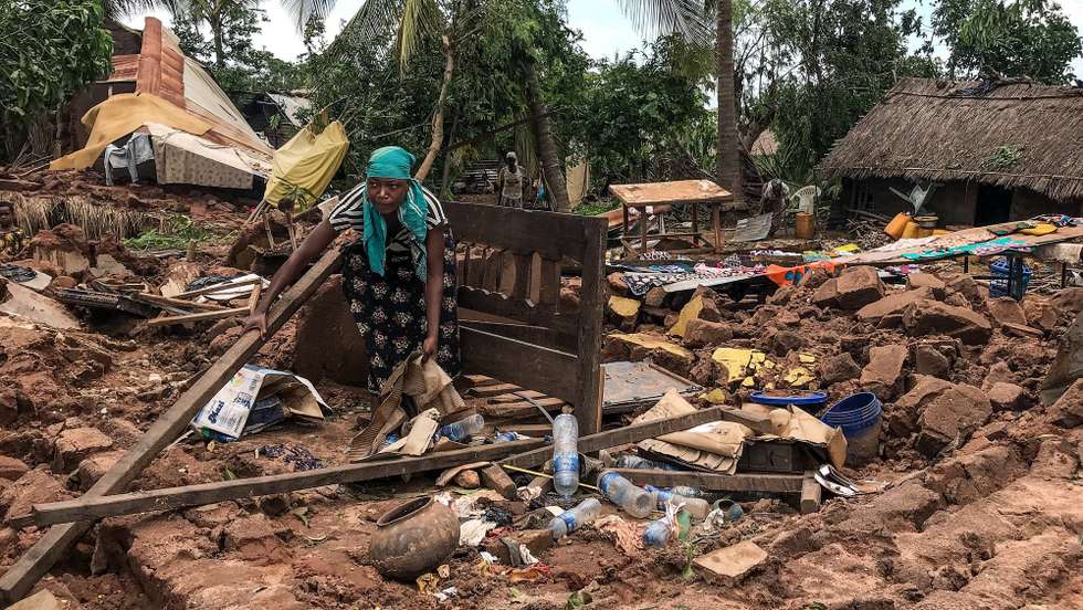 epa09822032 A local woman inspects the damages to the houses destroyed by Cyclone Gombe, Topelane neighborhood, Monapo village, Nampula province, Mozambique, 13 March 2022. Storm Gombe reached the Mozambican coast in the early hours of 11 March morning in the category of an intense cyclone with torrential rain and wind of 165 kilometers per hour, with gusts exceeding 200 km/hour.  EPA/ANDRE CATUEIRA