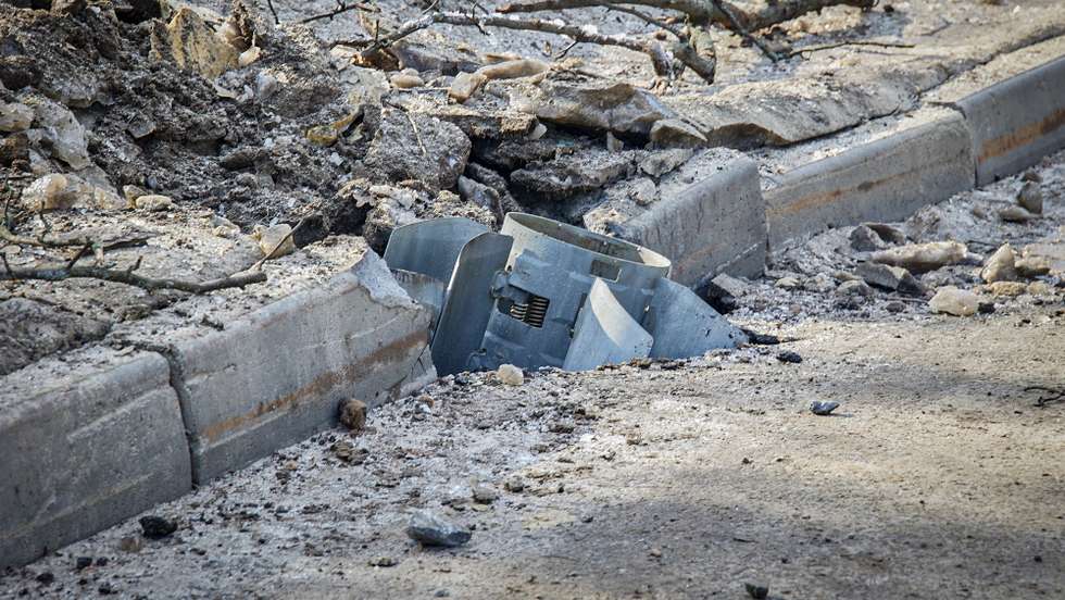 epaselect epa09780968 A jet missile wedged into a damaged roadside in the aftermath of Russian military operation in Kharkiv, Ukraine, 24 February 2022. Russian President Vladimir Putin announced a 'special military operation' in the Donbass with the aim, as he put it, of demilitarizing and denazifying Ukraine, as well as bringing to justice those who committed numerous bloody crimes against civilians. Martial law has been introduced in Ukraine, explosions are heard in many cities, including Kiev after Russian troops launched a major military operation on Ukraine on 24 February.  EPA/SERGEY KOZLOV