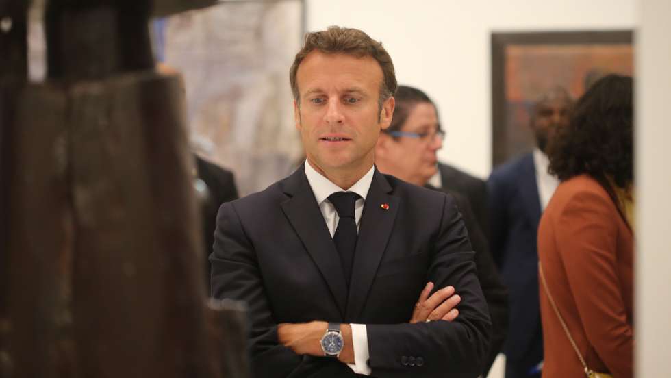 epa10094144 French President Emmanuel Macron attends the opening of a hybrid art exhibition in Cotonou, Benin, 27 June 2022, during the official visit of Macron to the Republic of Benin.  EPA/AKINTUNDE AKINLEYE