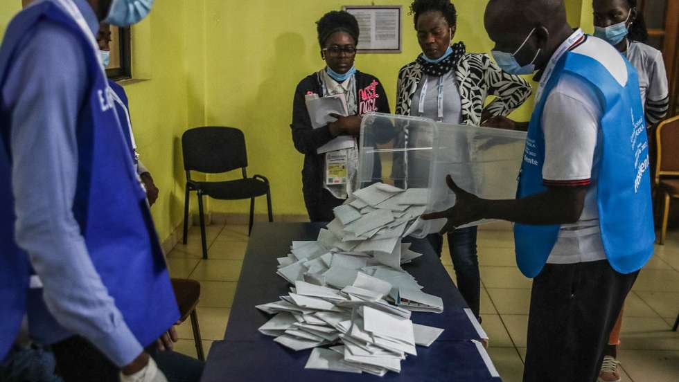 epa10136664 Election officials count the votes after the polls closed in the general elections at a polling station in Luanda, Angola, 24 August 2022. The general elections will define the composition of parliament and the names of the President and Vice President of the Republic.  EPA/PAULO NOVAIS