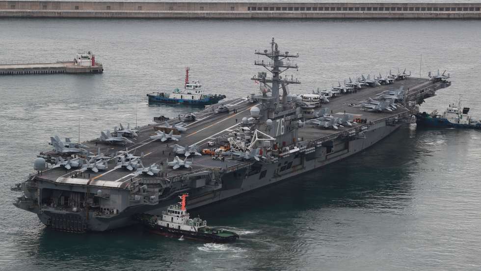 epa10206655 The US nuclear-powered aircraft carrier Ronald Reagan sails from a naval base as South Korea and the United States kicked off their first combined naval exercises, involving the American aircraft carrier, near the peninsula in five years, in Busan, southeastern South Korea, 26 September 2022. The four-day drills came as Seoul and Washington are cranking up security cooperation amid continued speculation that North Korea could engage in provocative acts, like a nuclear test or submarine-launched ballistic missile launch.  EPA/YONHAP SOUTH KOREA OUT