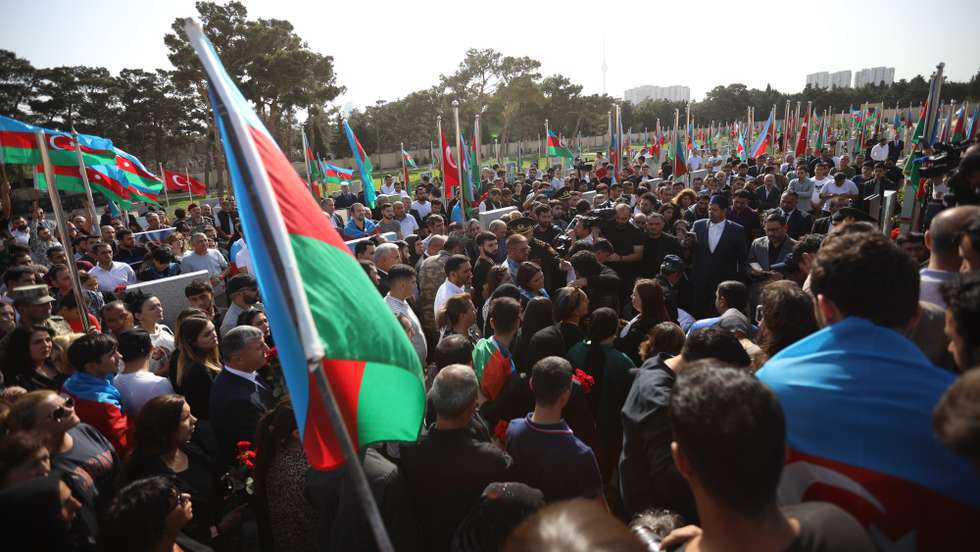 epa10183778 Azeri people gather for mass funerals of Azeri servicemen who were killed during clashes with Armenian troops on the border with Armenia, at the cemetery near Baku, Azerbaijan, 14 September 2022. Armenia and Azerbaijan exchanged artillery fire on the night to 13 September, prompting fears of escalation, with both sides blaming each other for the initial provocations. According to the Armenian side, from midnight, Azerbaijan began to conduct intense fire in the direction of the settlements of Sotka, Goris and Jermuk in the southeast of the country from artillery pieces and large-caliber weapons. According to the Armenian Defense Ministry, at least 105 people from the Armenian side died as a result of the conflict. Baku and Yerevan, through the mediation of Moscow, were able to agree on a ceasefire from 09:00 Moscow time, the Russian Foreign Ministry reported. The Azerbaijani Defense Ministry reported that the reason for the aggravation was 'intensive shelling over the past month of the positions of the Azerbaijani army in the Kalbajar, Lachin, Dashkesan and Gedabek directions and large-scale provocations committed today,' and placed all responsibility for what happened on the military leadership of Armenia. According to the information by the Azerbaijan Defence ministry, 50 Azeri servicemen have been killed in last two days.  EPA/ROMAN ISMAYILOV