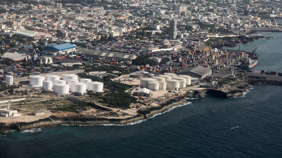 epa08075483 An aerial view picture shows the Mogadishu International Port in Mogadishu, Somalia, 14 December 2019 (issued 16 October 2019). The Somali capital is split into two totally separate worlds by a kilometer-long bomb-proof barrier: the conflict-riddled Mogadishu and the secure 'Green Zone', an urban bubble which is home to UN personnel, diplomats, bodyguards, soldiers and spies.  EPA/Daniel Irungu
