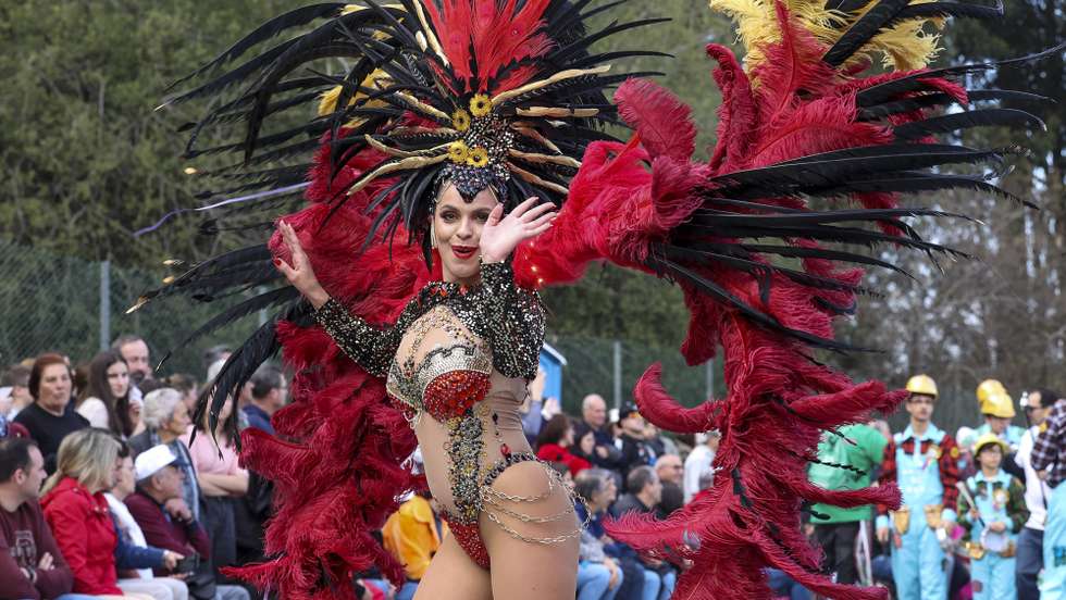 A woman dressed up in a carnival costume dances during the carnival parade in Ovar, Northern of Portugal, 19 February 2023. PAULO NOVAIS/LUSA