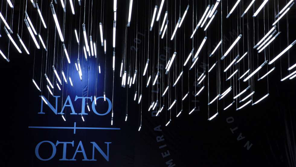 epa02457324 General view of the ceiling lights and the NATO (North Atlantic Treaty Organisation) logo during the second day of the Lisbon Nato Summit on 20 November 2010 in Lisbon, Portugal. Leaders of Nato's 28 states have backed a strategy to transfer leadership for the fight against the Taliban to Afghan forces by the end of 2014.  EPA/ESTELA SILVA
