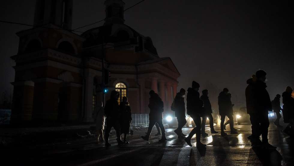 epa10355496 People walk in a street as life without electricity continues in Kyiv, Ukraine, 08 December 2022. Kyiv and large parts of the Ukraine have been affected by power cuts since Russian missile attacks targeted the energy infrastructure. Russian troops on 24 February entered Ukrainian territory, starting a conflict that has provoked destruction and a humanitarian crisis.  EPA/OLEG PETRASYUK
