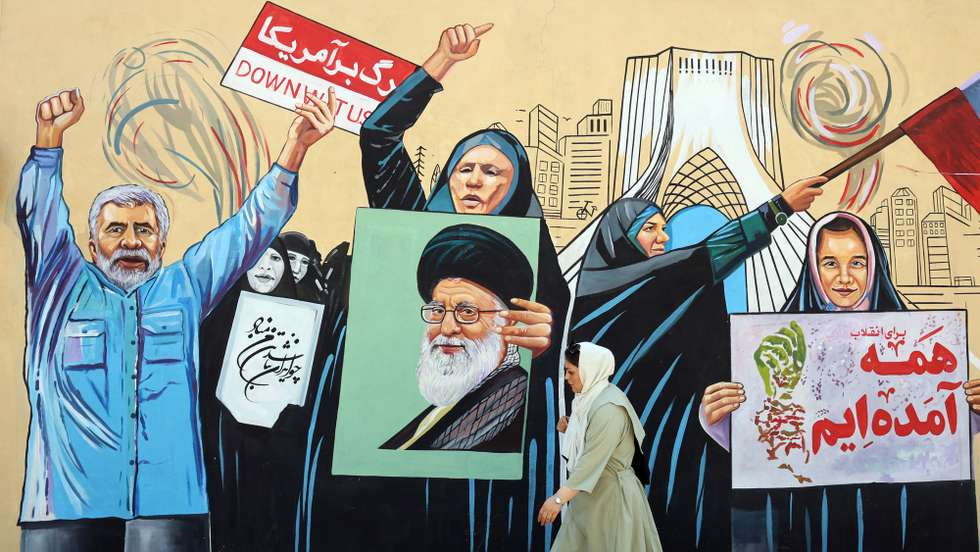 epa13012532 An Iranian woman walks next to an anti-US and Israeli mural in Tehran, Iran, 03 June 2026. Iran and the US traded strikes despite a ceasefire as the conflict involving Iran, the US, and Israel continues. According to US Central Command (CENTCOM), US forces intercepted multiple Iranian ballistic missiles and drones and conducted self-defense strikes on Qeshm Island in response to attempted attacks by Iran across the Middle East targeting US military bases.  EPA/ABEDIN TAHERKENAREH RESTRICTIONS: NO Access Israel Media/Persian Language TV Stations Outside Iran/Strictly No Access BBC Persian/VOA Persian/Manoto TV/Iran International TV. (As mandated by Iran's Directorate General for Foreign Media) --