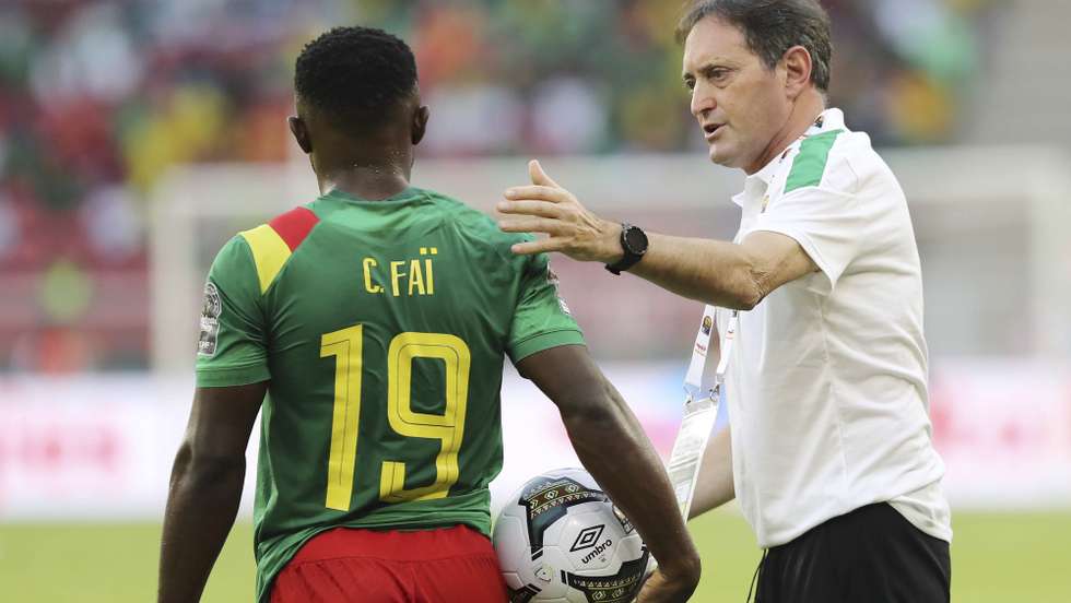epa09676267 Cameroon coach Antonio Conceicao and player Ngoran Suiru Fai of Cameroon during the 2021 Africa Cup of Nations soccer match between Cameroon and Burkina Faso at Olembe Stadium in Yaounde, Cameroon, 09 January 2022.  EPA/GAVIN BARKER