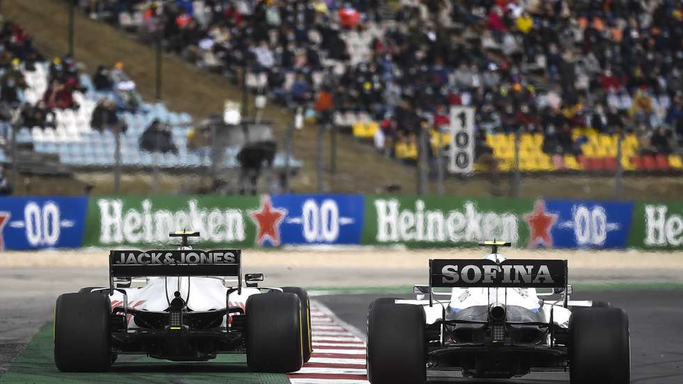 epa08772848 Danish Formula One driver Kevin Magnussen (L) of Haas F1 Team steers his car during the Formula One Grand Prix of Portugal at the Autodromo Internacional do Algarve near Portimao, Portugal, 25 October 2020.  EPA/Jorge Guerrero / Pool