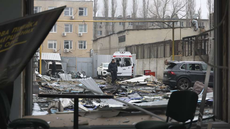epa12734233 Ukrainian people survey the site of the overnight Russian attack on the residential area in Odesa, Ukraine, 13 February 2026, amid the ongoing Russian invasion. At least one person was killed, and six others were injured during the Russian attack in Odesa, according to the State Emergency Service.  EPA/IGOR MASLOV 110091