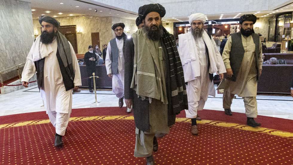 epa09082252 Taliban co-founder Mullah Abdul Ghani Baradar (C) arrives with other members of the Taliban delegation for attending an international peace conference in Moscow, Russia, 18 March 2021. Russia is hosting a peace conference for Afghanistan, bringing together government representatives and their Taliban adversaries along with regional observers in a bid to help jump-start the country's stalled peace process. The one-day gathering Thursday is the first of three planned international conferences ahead of a May 1 deadline for the final withdrawal of U.S. and NATO troops from the country, a date fixed under a year-old agreement between the Trump administration and the Taliban.  EPA/ALEXANDER ZEMLIANICHENKO / POOL