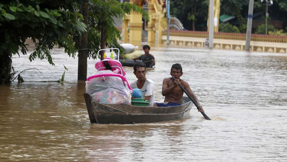 epa11603204 People carry their belonging as they sail through the flood waters in Taungoo, Bago division, Myanmar, 14 September 2024. Heavy rains triggered by Typhoon Yagi have caused severe flooding in parts of Myanmar, leaving thousands stranded in their homes, with further heavy rainfall and thunderstorms expected, according to the state weather office. A statement from the Military announced 59,413 households were affected in 34 townships and set up 187 relief camps for the 236,649 people. There were 33 casualties due to the flood in the country including the Naypyitaw.  EPA/NYEIN CHAN NAING