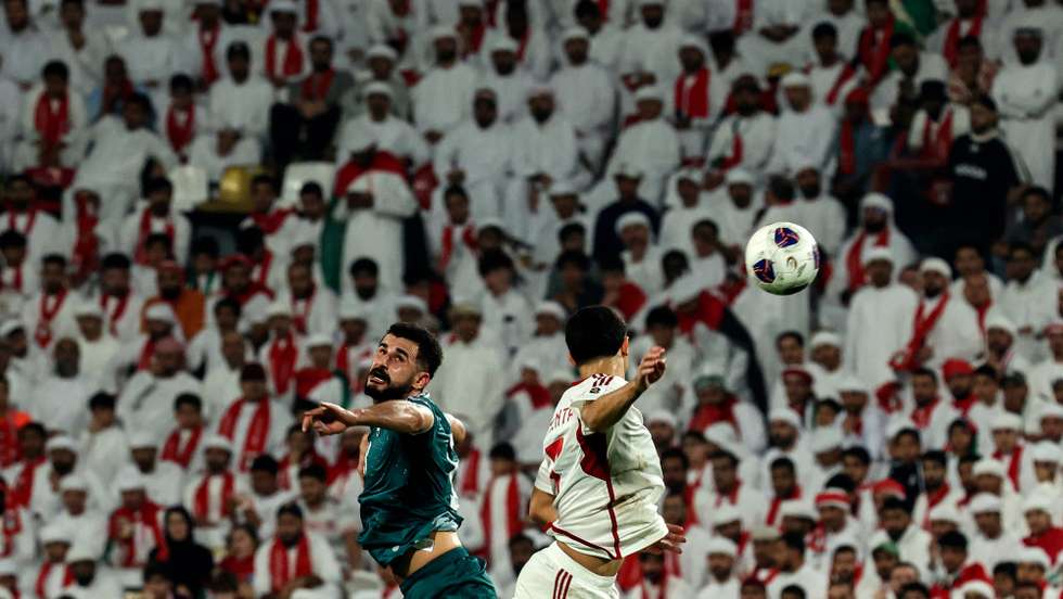 epa12523888 Aymen Hussein (L) of Iraq and Lucas Pimenta of the UAE in action during the FIFA World Cup 2026 Asian qualifiers play-off 1st leg soccer match between UAE and Iraq in Abu Dhabi, United Arab Emirates, 13 November 2025.  EPA/ALI HAIDER