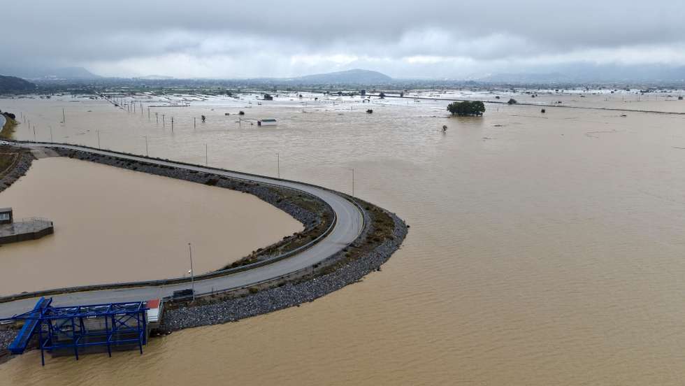 epa13280238 A drone photograph shows flooded farmland on the Lasithi Plateau following severe weather that struck Crete, Greece, 04 October 2026. Severe weather that swept across Crete caused extensive damage. In the Lasithi Plateau, 18,000 of the 25,000 stremmas (approximately 4,450 acres) of farmland have been flooded, while at least 3,000 tonnes of potatoes have been submerged.  EPA/NIKOS CHALKIADAKIS