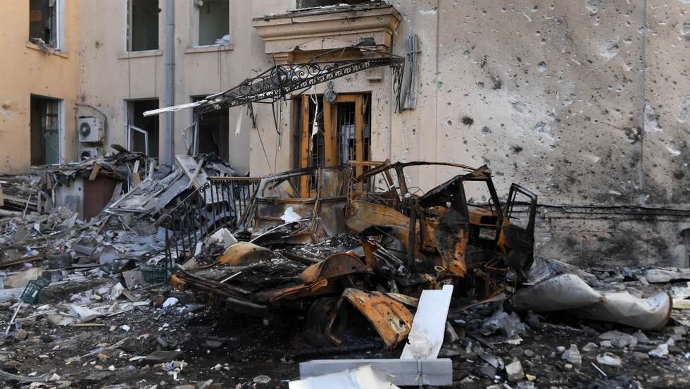 epa09842954 A car destroyed after shelling is seen in Kharkiv, Ukraine, 22 March 2022. Russian troops entered Ukraine on 24 February prompting the country's president to declare martial law and triggering a series of severe economic sanctions imposed by Western countries on Russia.  EPA/Andrzej Lange POLAND OUT