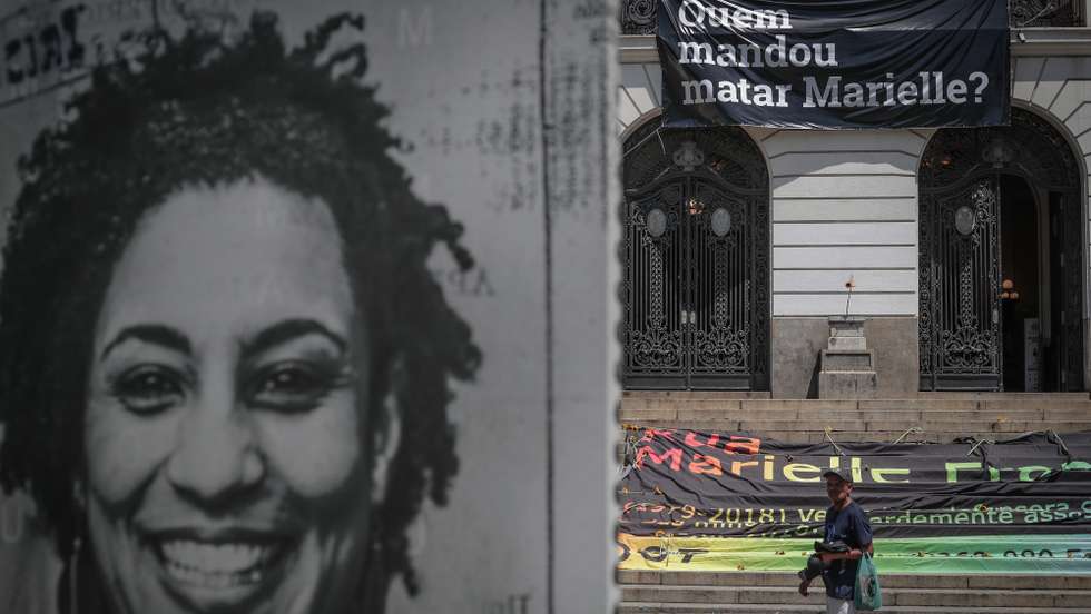 epa09824577 A person walks through the place where an act is performed to mark the four years anniversary since the assassination of the Brazilian councilor and human rights activist Marielle Franco, organized by Amnesty International, in Rio de Janeiro, Brazil, 14 March 2022. Marielle Franco, black, homosexual, from a favela in Rio de Janeiro and who stood out for her energetic action in defense of minorities, was shot dead on March 14, 2018 along with the driver of her vehicle Anderson Gomes, after participating in a political meeting in the city center.  EPA/Andre Coelho