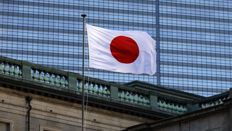 epa12635979 The Japanese national flag flutters at the Bank of Japan (BOJ) headquaters in Tokyo, Japan, 08 January 2026. The Bank of Japan is continuing to nominally raise their interest rates from near zero, in December 2025 raising rates 25 basis points.  EPA/FRANCK ROBICHON
