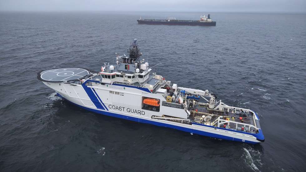 epa11795031 A handout photo dated made available by the Finnish Border Guard on 27 December 2024 shows a border guard vessel and tanker Eagle S off Porkkalanniemi peninsula, Finland, 27 December 2024. Finnish authorities are investigating the Eagle S, an oil tanker registered with the Cook Islands, suspected of having caused the outage of an undersea power cable connecting Finland and Estonia on 25 December.  EPA/HANDOUT HANDOUT EDITORIAL USE ONLY/NO SALES