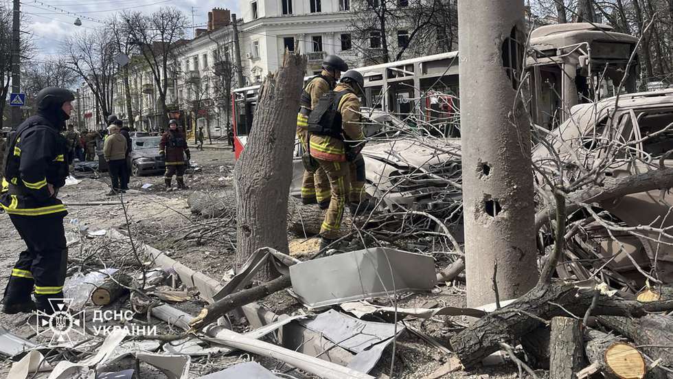 epa12029025 A handout photo made available by the State Emergency Service of Ukraine (SES) shows Ukrainian rescuers working at the site of a rocket strike in downtown Sumy, Ukraine, 13 April 2025, amid the ongoing Russian invasion. At least 31 people were killed, including two children, and 84 people were injured, including 10 children, after a Russian rocket hit downtown Sumy in the morning, according to a report by the State Emergency Service.  EPA/STATE EMERGENCY SERVICE OF UKRAINE HANDOUT  HANDOUT EDITORIAL USE ONLY/NO SALES