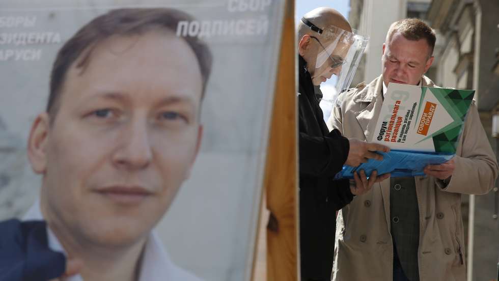 epa08439543 Supporters of Andrei Dmitriev, a potential candidate in presidential elections, gather signatures in support of their candidate in Minsk, Belarus, 23 May 2020. The presidential campaign has kicked off in Belarus, with the election scheduled for 09 August 2020. Incumbent President Alexander Lukashenko, who has held an iron grip on power since Belarus' independence in 1991, is the clear frontrunner to win reelection for a sixth consecutive term.  EPA/TATYANA ZENKOVICH