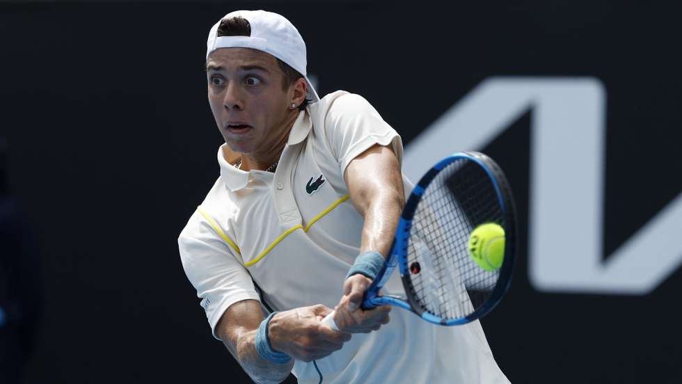 epa11091179 Ugo Humbert of France in action against Hubert Hurkacz of Poland during the Men's 3rd round match at the Australian Open tennis tournament in Melbourne, Australia, 20 January 2024.  EPA/MAST IRHAM