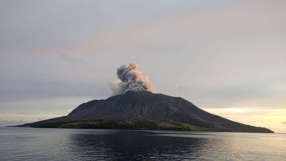 epa11288018 A handout photo made available by the Indonesian National Search and Rescue Agency (BASARNAS) shows smoke and ash erupting from Mount Ruang as seen from Tagulandang village, in North Sulawesi, Indonesia, 19 April 2024. The Center for Volcanology and Geological Disaster Mitigation (PVMBG) of the Ministry of Energy and Mineral Resources reported that Mount Ruang in the Sitaro Islands Regency, North Sulawesi, erupted on 16 April night. As a result of the eruption of Mount Ruang, 272 families, or around 828 people, were evacuated.  EPA/BASARNAS HANDOUT  HANDOUT EDITORIAL USE ONLY/NO SALES HANDOUT EDITORIAL USE ONLY/NO SALES HANDOUT EDITORIAL USE ONLY/NO SALES