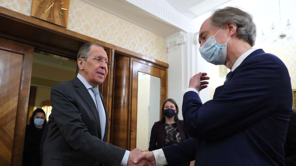 epa09778291 A handout photo made available by the press service of the Russian Foreign Affairs Ministry shows Russian Foreign Minister Sergei Lavrov (front L) welcoming UN Special Envoy for Syria Geir Pedersen (R) during their meeting in Moscow, Russia, 23 February 2022. The UN Special Envoy for Syria is on a working visit to Moscow.  EPA/RUSSIAN FOREIGN AFFAIRS MINISTRY HANDOUT -- MANDATORY CREDIT -- HANDOUT EDITORIAL USE ONLY/NO SALES