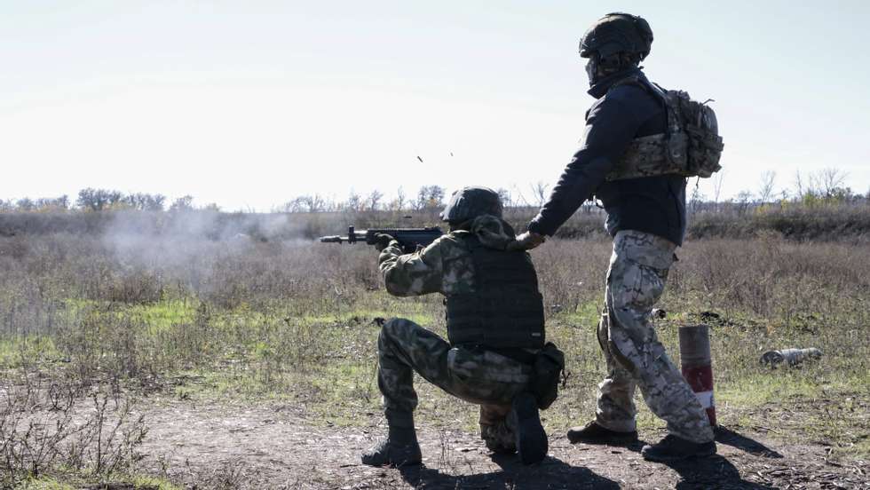 epa10224891 A Russian conscript with an instructor attends a shooting training at a military shooting range near Donetsk, Ukraine, 05 October 2022. Russian President Putin announced in a televised address to the nation on 21 September, that he signed a decree on partial mobilization in the Russian Federation. Russian Defense Minister Shoigu said that 300,000 people would be called up for service as part of the move. On 24 February 2022 Russian troops entered the Ukrainian territory in what the Russian president declared as a &#039;Special Military Operation&#039;, starting an armed conflict that has provoked destruction and a humanitarian crisis.  EPA/ALESSANDRO GUERRA