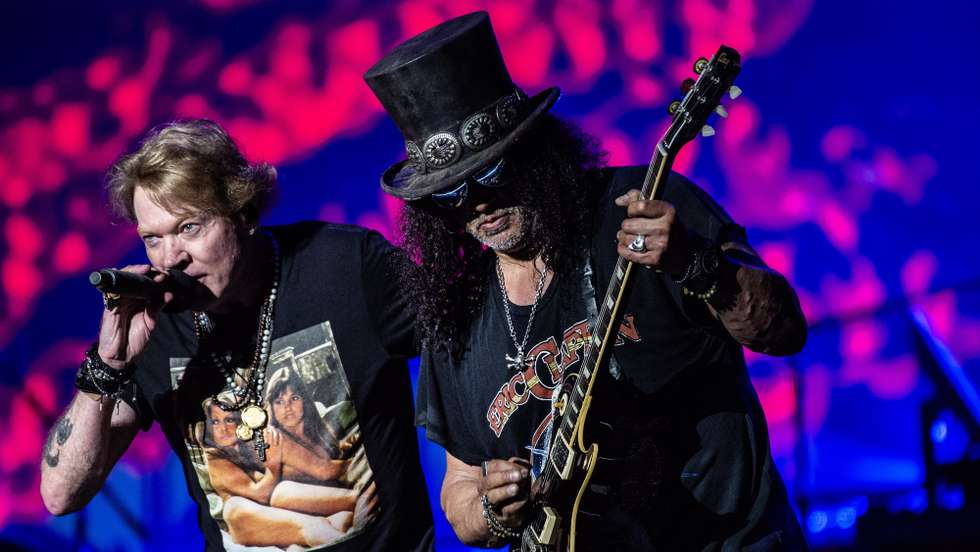 epaselect epa10698132 Axl Rose (L) and Slash (R) of US band Guns N' Roses perform during the closing night of Copenhell heavy metal festival in Copenhagen, Denmark, 17 June 2023 (issued 18 June 2023).  EPA/Helle Arensbak  DENMARK OUT