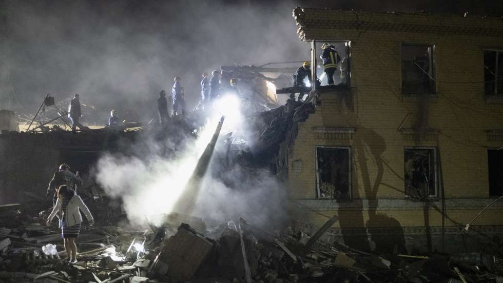 epa12050434 Ukrainian rescuers work at the site where a rocket struck a residential building in Kyiv, Ukraine, 24 April 2025, amid the ongoing Russian invasion. Russia launched a large-scale overnight attack using a combination of drones and various types of rockets. At least two people were killed and 54 others injured, including six children, in the strike on the residential building.  EPA/SERGEY SHESTAK