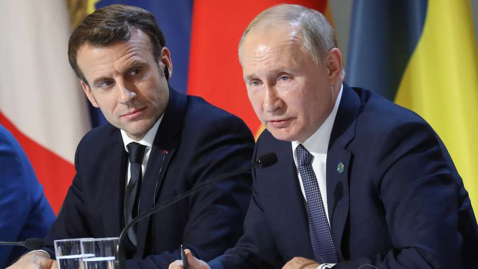 O Presidente francês Emmanuel Macron e o Presidente russo, Vladimir Putin numa conferência de imprensa em Paris, França, 9 de dezembro de 2019