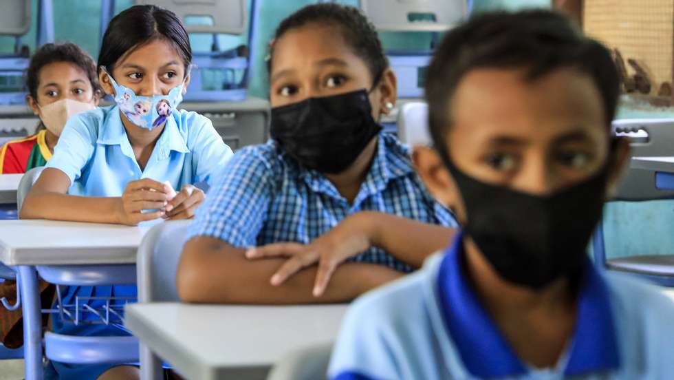 epa08522244 Students wearing protective face masks during a class at a reopened school amid an easing of coronavirus restrictions in Dili, East Timor, also known as Timor Leste, 02 July  2020. The government has officially reopened schools with covid-19 safety measures  EPA/ANTONIO DASIPARU