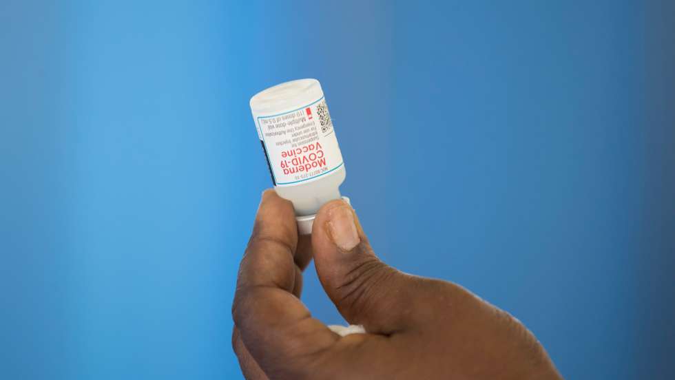 epa09353700 A nurse prepares a dose of Moderna's vaccine against covid-19 at the Saint Damien Hospital in Port-au-Prince, Haiti, 19 July 2021.  EPA/Orlando Barria