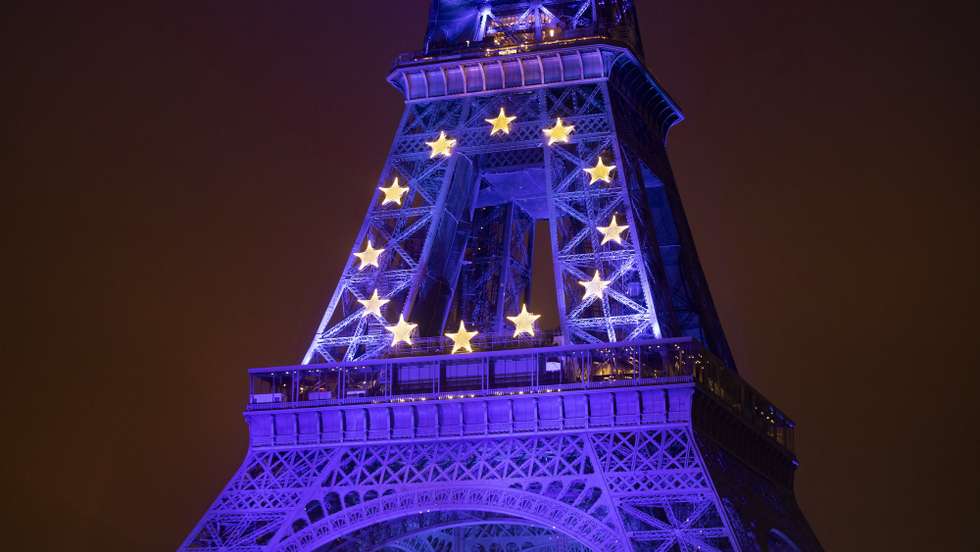 epa09662018 The Eiffel Tower is illuminated in the colors of the European Union flag to mark the start of France presidency of the EU on 01 January, in Paris, France, 31 December 2021.  EPA/IAN LANGSDON